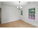 Cozy dining room with hardwood floors, natural light, and a view of the outdoors at 2530 Cochrane Dr, Charlotte, NC 28269