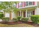 A well-maintained two-story home with red shutters, neat landscaping, and a welcoming entrance at 2530 Cochrane Dr, Charlotte, NC 28269