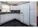 Clean kitchen with white cabinets, black and grey backsplash, and a white refrigerator with dispenser at 3012 Morgan Mill Rd, Monroe, NC 28110
