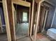Bedroom view during renovation showing framing and exposed ceiling beams with a single window at 334 Whitner St, Rock Hill, SC 29730