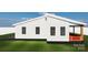 Side view of a cozy house, featuring a quaint porch and simple design details on a well-maintained lawn at 334 Whitner St, Rock Hill, SC 29730