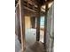 An interior view of exposed framework in a home under renovation, door on the right at 334 Whitner St, Rock Hill, SC 29730