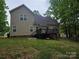 Backyard featuring a deck, lush green grass and mature trees at 4203 Flint Dr, Lancaster, SC 29720
