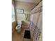 Bathroom featuring a toilet and shower/tub combo, with patterned curtain at 4203 Flint Dr, Lancaster, SC 29720