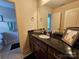 Bathroom with granite countertop, a single sink and dark wood vanity at 4203 Flint Dr, Lancaster, SC 29720
