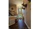 Welcoming two-story foyer with hardwood floors, staircase, chandelier, and deer head mounts at 4203 Flint Dr, Lancaster, SC 29720