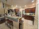 Well-equipped kitchen with granite countertops, stainless steel appliances, and breakfast bar at 4203 Flint Dr, Lancaster, SC 29720