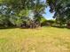 A spacious backyard features mature trees and lush greenery, providing a serene and natural setting at 437 Old Mountain Rd, Statesville, NC 28677