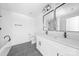 Modern bathroom features a double vanity with matte black hardware and tiled shower at 5115 Carden Dr, Charlotte, NC 28227