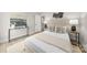 Comfortable bedroom featuring a console table, lamps, and neutral-toned decor at 5115 Carden Dr, Charlotte, NC 28227