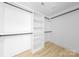 Walk-in closet offers ample storage with built-in shelving and wood flooring at 5115 Carden Dr, Charlotte, NC 28227
