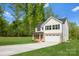 Charming two-story home featuring a brick and white exterior, attached garage, and a well-manicured lawn at 5115 Carden Dr, Charlotte, NC 28227