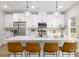 Modern kitchen with stainless steel appliances, a central island, pendant lights, and breakfast bar seating at 5115 Carden Dr, Charlotte, NC 28227