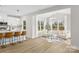 Open concept kitchen flows into the living room, featuring comfortable seating and a large window for natural light at 5115 Carden Dr, Charlotte, NC 28227