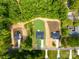 Aerial view of a new construction homesite with a landscaped yard and a wooded backdrop at 5125 Carden Dr, Charlotte, NC 28227