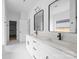 Bathroom showcasing double sinks with quartz countertops and modern black fixtures at 5125 Carden Dr, Charlotte, NC 28227