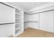 Walk-in closet offering ample storage with custom shelving and hanging rods at 5125 Carden Dr, Charlotte, NC 28227