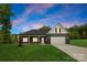 Charming home with a manicured lawn, a two-car garage, and a covered front porch at 5125 Carden Dr, Charlotte, NC 28227