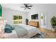 Serene main bedroom featuring a sliding glass door, wood floors, and a calming color scheme at 5125 Carden Dr, Charlotte, NC 28227