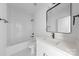 Modern bathroom with subway tile, black fixtures, vanity, and a bathtub with shower at 5209 Carden Dr, Charlotte, NC 28227