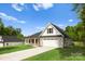 Attractive brick house with attached garage and long driveway, set on a lush green lawn at 5209 Carden Dr, Charlotte, NC 28227