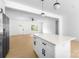 Open floor plan kitchen with a large center island, stainless steel appliances, and lots of natural light at 5209 Carden Dr, Charlotte, NC 28227