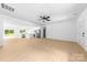 Open-concept living area leading to the kitchen, perfect for entertaining and modern living at 5209 Carden Dr, Charlotte, NC 28227