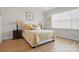 Cozy bedroom with hardwood floors, and matching end tables with lamps at 5247 Looking Glass Trl, Denver, NC 28037