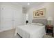 Neutral bedroom with carpet, closet and a painting hanging over the bed at 5247 Looking Glass Trl, Denver, NC 28037