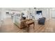 Open-concept living space with modern furnishings, wood floors, and built-in cabinets at 5247 Looking Glass Trl, Denver, NC 28037