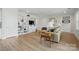 Bright living room with hardwood floors, built-in bookshelves, and a cozy seating area at 5247 Looking Glass Trl, Denver, NC 28037