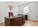 Office space with a large wooden desk, a window and hardwood flooring at 5247 Looking Glass Trl, Denver, NC 28037