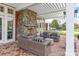 Inviting outdoor patio with a stone fireplace and comfortable seating area, perfect for entertaining at 5247 Looking Glass Trl, Denver, NC 28037