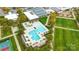 Aerial view of a stunning community pool with lounge chairs and umbrellas for relaxation at 5247 Looking Glass Trl, Denver, NC 28037