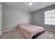 Simple bedroom with a cozy atmosphere, perfect for comfortable sleeping and privacy at 6001 Pine Cone Ln, Monroe, NC 28110