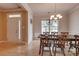 Dining room with wood floors and a traditional chandelier at 6001 Pine Cone Ln, Monroe, NC 28110