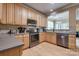 Well-equipped kitchen featuring stainless steel appliances and wood cabinets at 6001 Pine Cone Ln, Monroe, NC 28110