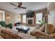 Inviting living room with fireplace, plush sofas, and large windows, creating a bright and welcoming space at 6001 Pine Cone Ln, Monroe, NC 28110