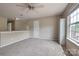 Versatile loft area with abundant natural light, ready to be customized into a perfect office or Gathering space at 6001 Pine Cone Ln, Monroe, NC 28110