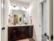 Bathroom with double vanity, tile floor, large mirror and plenty of light at 618 Chase Ct, Fort Mill, SC 29708