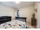 Bedroom featuring a dinosaur theme, dark wood crib, and light carpet at 618 Chase Ct, Fort Mill, SC 29708