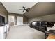 Relaxing bonus room featuring carpet, ceiling fan, and a comfortable sofa at 618 Chase Ct, Fort Mill, SC 29708