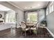 Dining room with a table for six, hardwood floors, and natural light at 618 Chase Ct, Fort Mill, SC 29708