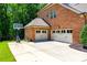 Three-car garage with basketball hoop and well-kept lawn at 618 Chase Ct, Fort Mill, SC 29708