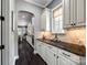 Kitchen with granite countertop and tile backsplash and view into the dining room at 618 Chase Ct, Fort Mill, SC 29708