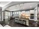 Gourmet kitchen with large island, counter seating, white cabinets and stainless steel appliances at 618 Chase Ct, Fort Mill, SC 29708