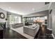Open-concept living area features a fireplace, large windows, and kitchen with granite island at 618 Chase Ct, Fort Mill, SC 29708