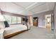 Primary bedroom showing bright light, tray ceilings, bedside tables, and decorative touches at 618 Chase Ct, Fort Mill, SC 29708