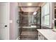Modern glass-enclosed shower with built in bench and dual shower heads at 618 Chase Ct, Fort Mill, SC 29708