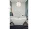 Elegant bathroom showcasing a freestanding tub with modern fixtures and stylish white tiling at 6508 Trenton Pl, Charlotte, NC 28226